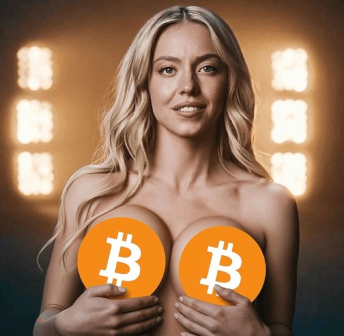 A woman is pictured with two Bitcoin logos obscuring her chest.