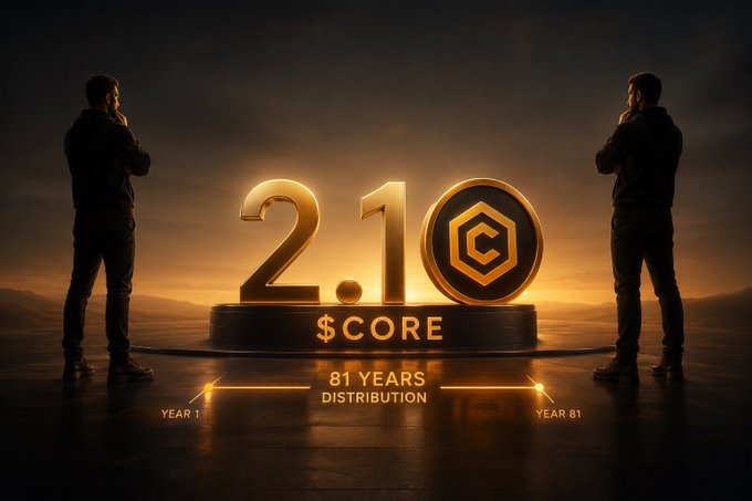 The image features two men standing next to a large white circle with gold text on it, which says "2.1B tokens Unit value gonna be heavy when adoption kicks in Gold standard energy in crypto Respect @Coredao_Org #CORE # Cryptocurrency # Cryptocurrencies". The people and the circle are positioned as if they're trying to fight over crumbs of a particular cookie or treat, symbolizing the potential rivalry that could arise from competing token values.