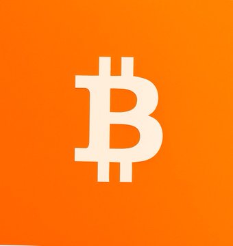 A simple, bold graphic featuring the white Bitcoin '₿' logo centered on a solid orange background.