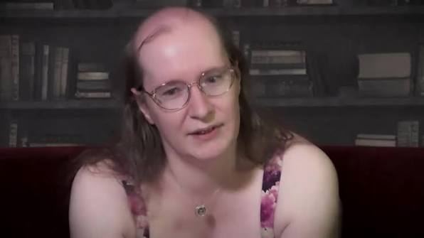 A woman with glasses and long hair sits in front of a bookshelf wearing a floral top. The image appears to be a screenshot from a video, likely related to the Zcash (ZEC) cryptocurrency hack referenced in the post, as her serious demeanor has become a meme image used in crypto communities discussing missed investment opportunities.