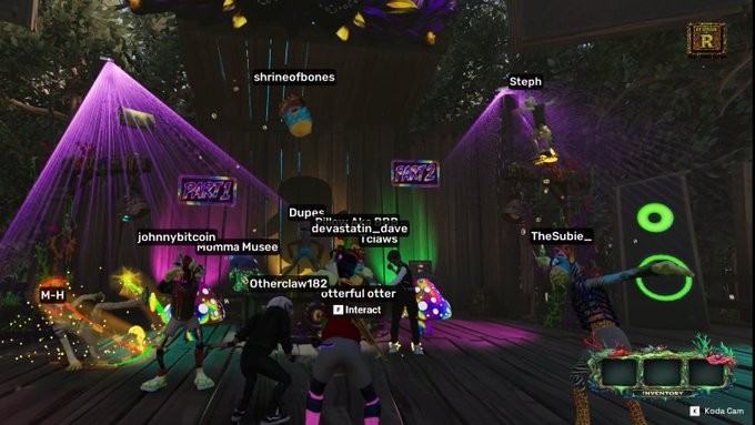 A screenshot from a virtual reality game showing multiple avatars with usernames like 'shrineofbones', 'Steph', and 'devastatin_dave' dancing on a wooden stage illuminated by purple and green lights.