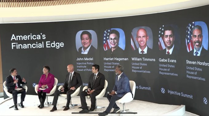 A panel discussion at the 'Injective Summit' titled 'America's Financial Edge,' featuring speakers identified as John Medel, Harriet Hageman, William Timmons, Gabe Evans, and Steven Horsford, all from the United States House of Representatives.