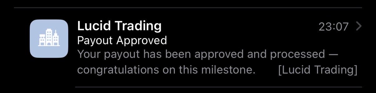 An iPhone notification from Lucid Trading at 23:07 announcing 'Payout Approved' and congratulating the user on the milestone of having their payout approved and processed.