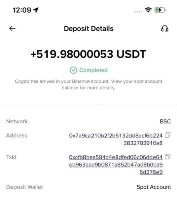 A mobile screenshot showing a completed Binance deposit of +519.98000053 USDT via the BSC network to a spot account.