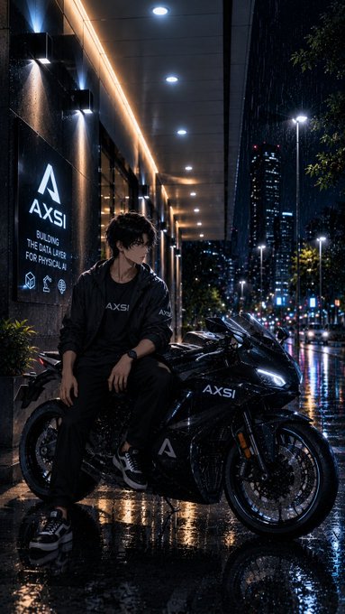 An anime-style illustration of a young man sitting on a black motorcycle branded "AXSI" on a wet city street at night, with a sign reading "AXSI BUILDING THE DATA LAYER FOR PHYSICAL AI" in the background.