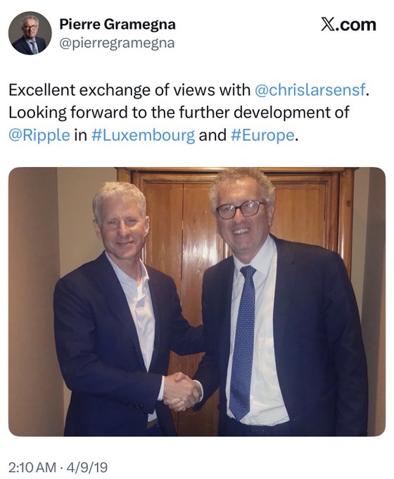A X.com post by Pierre Gramegna (@pierregramegna) reading 'Excellent exchange of views with @chrislarsensf. Looking forward to the further development of @Ripple in #Luxembourg and #Europe,' timestamped 2:10 AM · 4/9/19, showing two men in suits shaking hands.