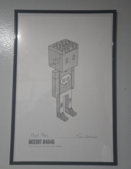 A framed pencil sketch of a blocky Minecraft 'Meebit #4045' character, signed by 'Matt Hall' and the artist, displayed against a wall.