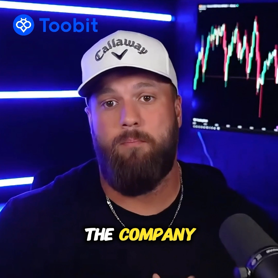 A bearded man wearing a white "Callaway" cap speaks into a microphone in a studio with blue neon lighting and a candlestick trading chart displayed behind him. The image features the "Toobit" logo in the top-left corner and the yellow text "THE COMPANY" at the bottom, supporting a post warning about crypto security and verifying exchange communications directly through official channels.