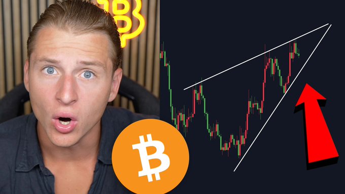 The image features a YouTuber with a surprised expression beside a Bitcoin chart showing an ascending wedge pattern with a red arrow pointing up, suggesting an imminent price surge. A Bitcoin logo is also visible. While the caption claims a "BIG #BITCOIN CRASH IS COMING," the chart pattern shown (a rising wedge) actually typically signals a potential bearish reversal, highlighting a contradiction between the message and the visual.