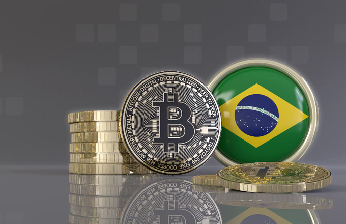 A digital illustration features a stack of gold Bitcoin coins alongside a prominent silver Bitcoin displaying its iconic 'B' logo and the text 'BITCOIN DIGITAL DECENTRALIZED PEER TO PEER FINE COPPER'. Next to it is a circular emblem showing the Brazilian flag with the motto 'ORDEM E PROGRESSO'.