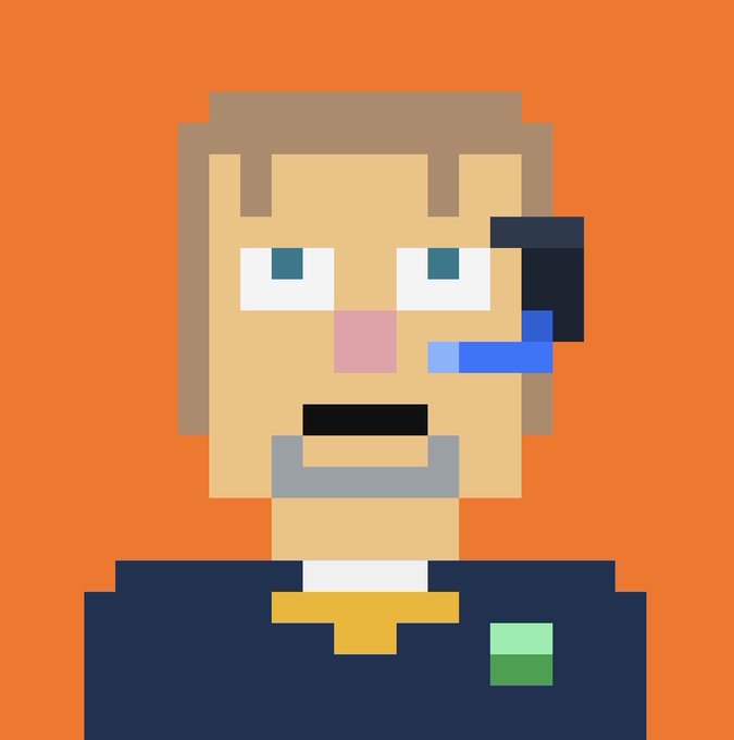 A pixel art portrait of a man with brown hair and a goatee, wearing a suit with a yellow tie and a green pocket square, set against an orange background. He appears to have a blue object, possibly a microphone or earpiece, near his face.