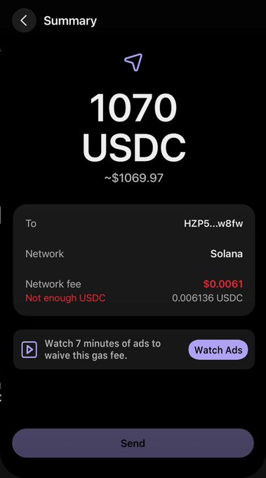 The image shows a cell phone screen with a message from an app called Watch 7 minutes of ads to cover gas fees, which appears to be related to the USDC payment made by the user. The text on the screen indicates that the user has already paid for their gas and is now waiting for the app to send them more money to cover any remaining gas costs. This message suggests that the app is trying to help users save money by alerting them about potential gas price fluctuations, so they can adjust their payments accordingly.