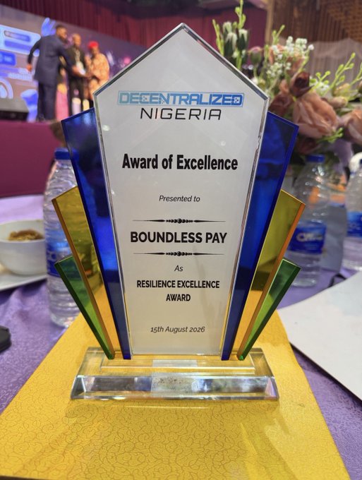 A glass 'Award of Excellence' trophy from Decentralized Nigeria presented to Boundless Pay as the 'Resilience Excellence Award', dated 15th August 2026.