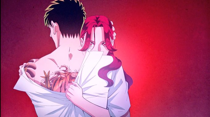 The image features a man with tattoos on his neck and shoulders, and a woman holding him close against a red background. The caption reads "GM CT Happy Saturday guys. Tell me whats you are doing today?". This suggests that they might be discussing their plans for the day or sharing some personal stories while enjoying each other's company in front of the tattooed man.