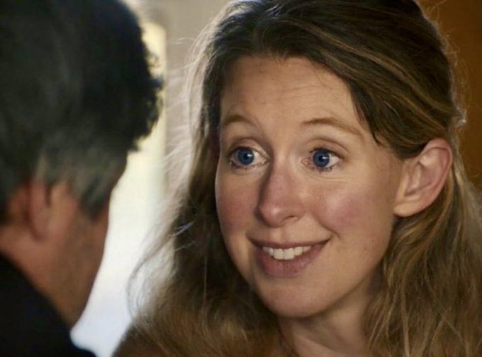 A young woman with long, wavy light brown hair smiles warmly at someone off-camera in an intimate close-up shot. Her expression and the caption's declaration about a "21M supply cap" suggest a moment of confident reassurance or commitment being shared between the two individuals.