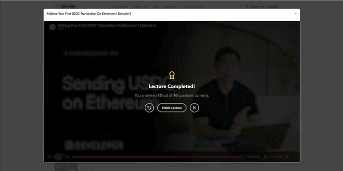 A screenshot of a completed Encode Club Arc Bootcamp lecture on "Making Your First USDC Transaction On Ethereum | Episode 6," showing a "Lecture Completed!" notification with a perfect score of 10 out of 10 questions answered correctly, alongside a "Finish Lecture" button over a blurred video thumbnail of a presenter.
