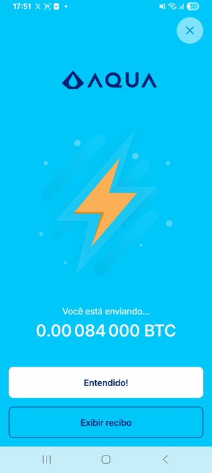 A screenshot of a mobile app called AQUA showing a transaction in progress: 'Você está enviando... 0.0084000 BTC' with 'Entendido!' and 'Exibir recibo' buttons in Portuguese.