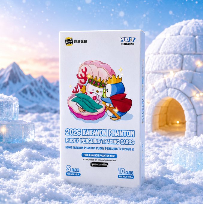 A box of '2026 KAKAMON PHANTOM PUDGY PENGUINS TRADING CARDS' sits in a snowy landscape with an ice igloo, featuring an illustration of a penguin character with a crown and 'Happy New Year' text, labeled '3 PACKS' and '10 CARDS'.