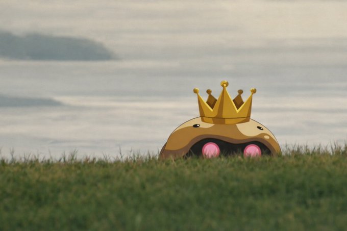 A Pokémon-themed edit of Diglett wearing a golden crown, peeking out of the grass with a misty landscape in the background.