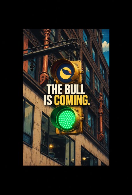 A stylized image featuring a green traffic light mounted on a building facade, overlaid with the bold text "THE BULL IS COMING."