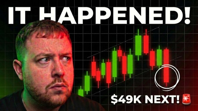 A YouTube thumbnail featuring a concerned-looking man illuminated by red and green lighting, positioned next to a candlestick chart showing a downward trend with the bold text "IT HAPPENED!" at the top and "$49K NEXT!" at the bottom, promoting a bearish Bitcoin price prediction video.