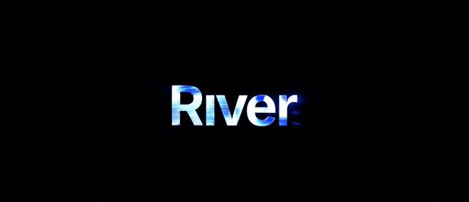 The image features a long, rectangular banner with the word "RIVER" written across it in blue letters against a black background. The text is slightly tilted to the right, giving it an artistic touch. Below the banner, there's some text that reads "@RiverdotInc". This suggests that the image might be related to a company or organization named @RiverdotInc, which could possibly be involved with cross-chain infrastructure and sustainability initiatives.
