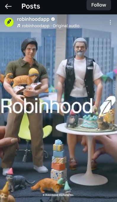 An Instagram post from robinhoodapp featuring two figurines (one holding a cat) at a table with cat figurines and a birthday cake, with the text 'Robinhood' and a rocket icon.