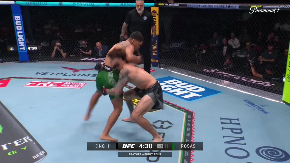 A UFC featherweight bout between King III and Rosas at 4:30 in R1, showing two fighters grappling in the octagon with a referee watching.