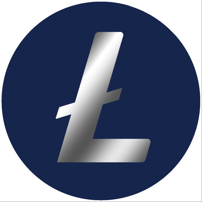 A silver metallic Litecoin (LTC) logo on a dark blue circular background.