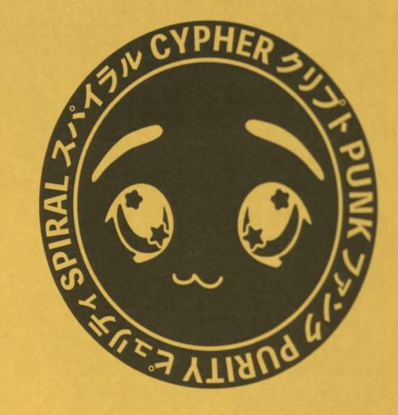 A yellow t-shirt features a circular black graphic with a stylized anime face and text in English and Japanese reading 'SPIRAL CYPHER PUNK', 'SPIRAL スハイラル', and 'PURITY ピュリティ'.