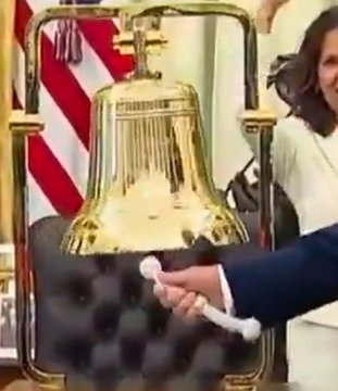 A large golden ceremonial bell is being struck with a mallet, evoking the image of a major financial exchange or institutional launch—visually paralleling the post's "#XRP" tag, likely referencing a significant milestone or listing for the XRP cryptocurrency.