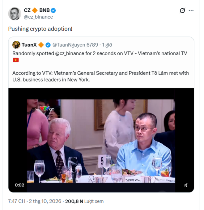 A tweet from CZ (cz_binance) titled 'Pushing crypto adoption!' featuring a video screenshot of him at a formal meeting on VTV, where he is seated next to another man in a suit.