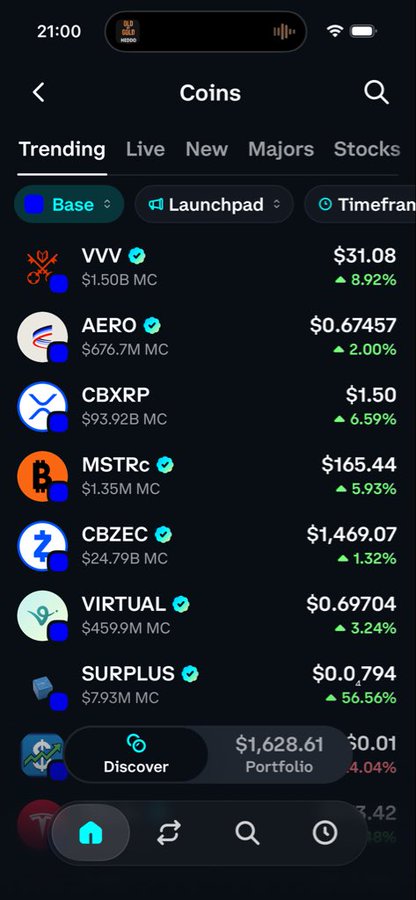 A mobile app screenshot showing a cryptocurrency tracking interface at 21:00 with trending coins including VVV ($31.08, +8.92%), AERO ($0.67457, +2.00%), CBXRP ($1.50, +6.59%), MSTRC ($165.44, +5.93%), CBZEC ($1,469.07, +1.32%), VIRTUAL ($0.69704, +3.24%), and SURPLUS ($0.0794, +6.56%).