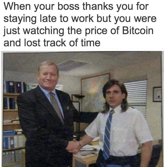 A meme with text reading 'When your boss thanks you for staying late to work but you were just watching the price of Bitcoin and lost track of time' above an image of a smiling older man in a suit shaking hands with a younger man in an office setting.