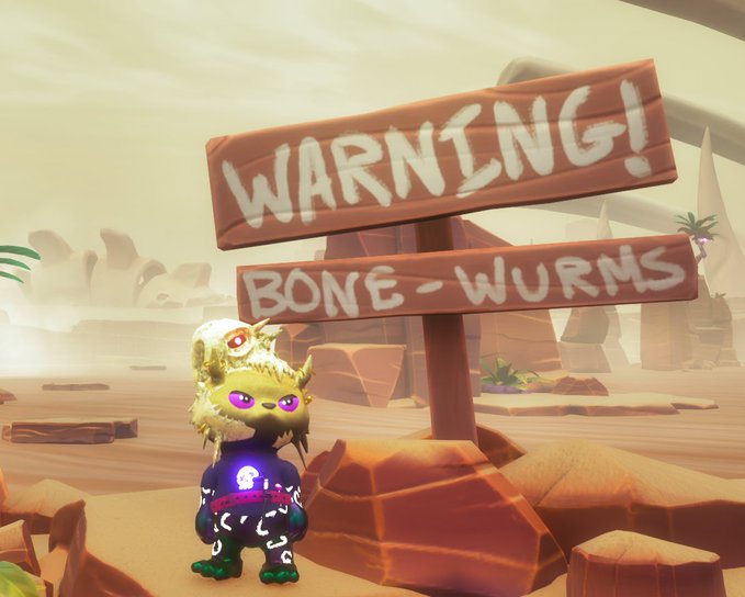 A video game character stands in a desert landscape next to a wooden sign that reads 'WARNING! BONE-WURMS'.