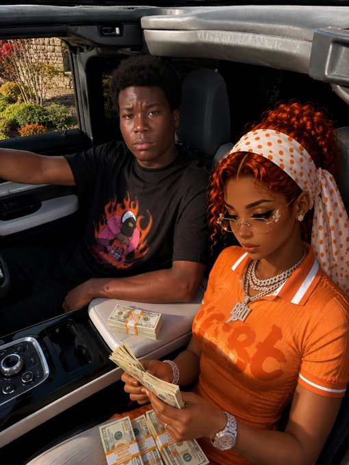 A photograph of a young couple in a convertible car, with the woman in an orange shirt and polka-dot headband counting cash while bundles of money sit on her lap, and the man wearing a graphic t-shirt beside her.