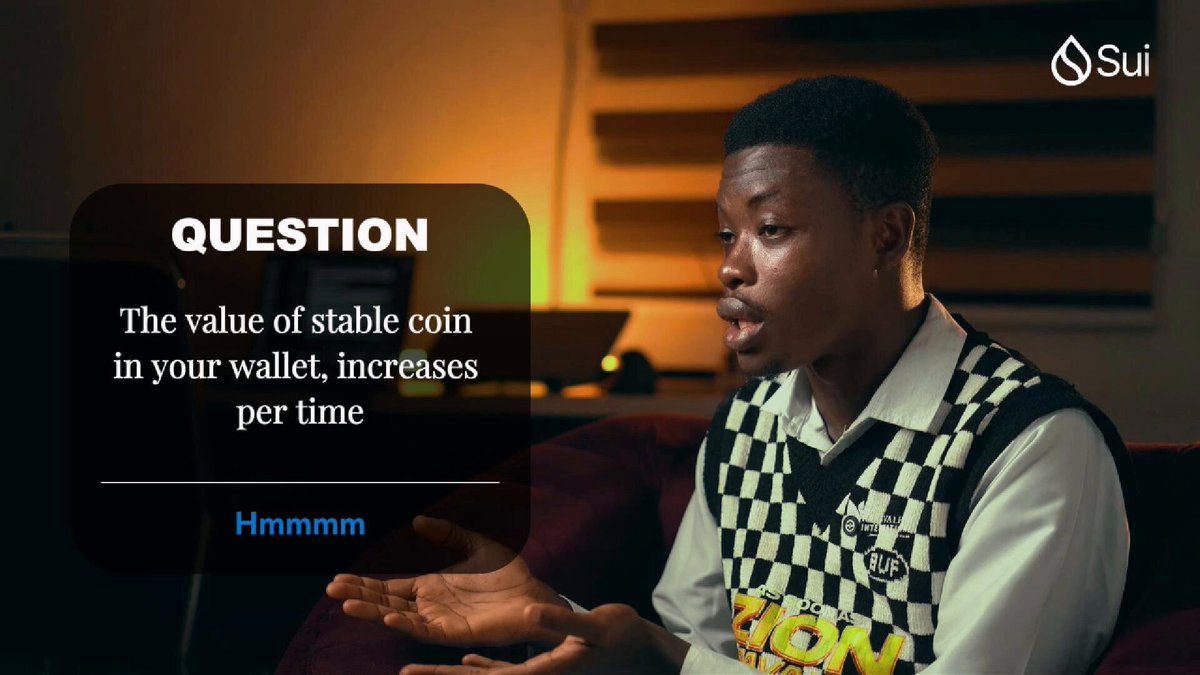 The image shows a man sitting down, wearing a black and white checkered shirt or vest. The background of the image features a couch and a chair, suggesting that he might be at home or in a casual setting. There are also two computer mice visible on the table next to him. The image is related to the post because it contains text about a question regarding the value of stable coin in your wallet and how it increases per time. This information can help users understand the potential benefits and drawbacks of investing in stablecoins, which may be useful for making informed decisions about their financial investments or transactions.