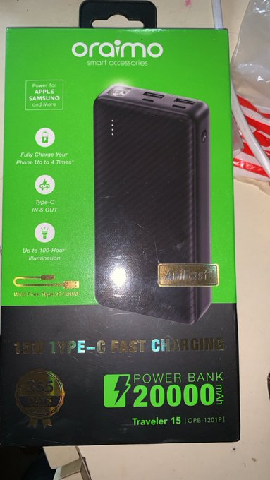 A green and black box for an 'oraimo' power bank, labeled '20000mAh' and 'Traveler 15 (OPB-1201P)', featuring '15W TYPE-C FAST CHARGING'.