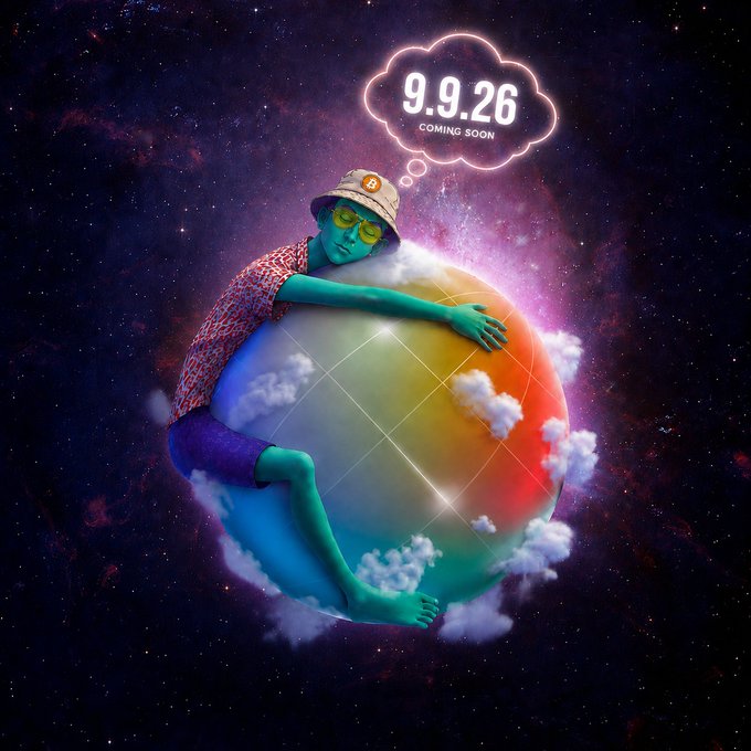 A surreal digital artwork of a green-skinned figure hugging a rainbow-colored sphere floating in space, with a thought bubble displaying '9.9.26 COMING SOON'.