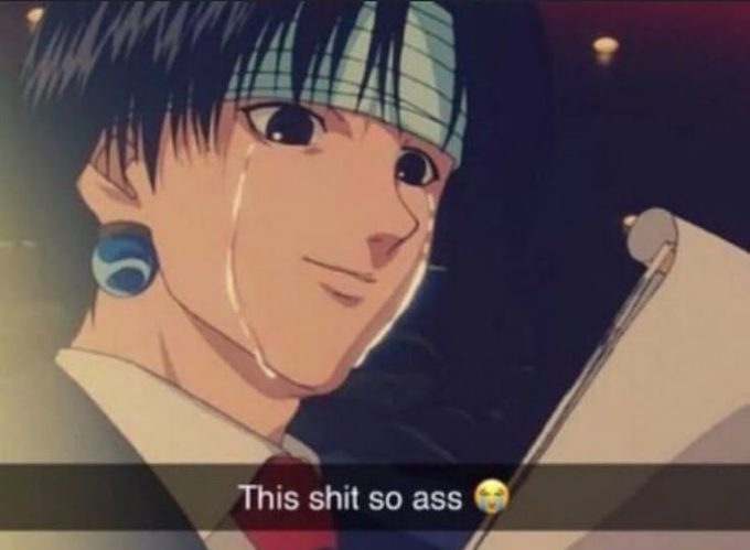 A crying anime character with a checkered headband and a blue earring is shown with the meme caption 'This shit so ass 😭' overlaid at the bottom.