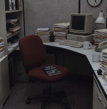 A cluttered office workspace features a desk stacked with papers, an old CRT monitor, a keyboard, and a red office chair with a 'HOW TO LOSE WEIGHT' magazine on the seat.