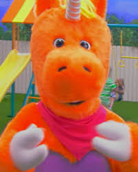A fuzzy orange teddy bear wearing a pink and purple outfit is shown in a blurry close-up, fitting the casual "$BUDDY" meme reference to a KOL (key opinion leader) mascot. The bear's worn, scrappy appearance visually reinforces the playful "BUDDY" branding in the post.