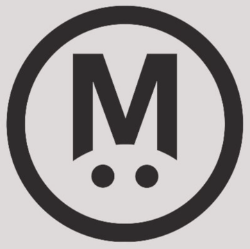 The image shows the "M" logo of MegaETH, which is shutting down its Mega Mafia accelerator program after two years. The program supported 20 startups that collectively raised $80 million, but failed to generate significant value for the protocol.