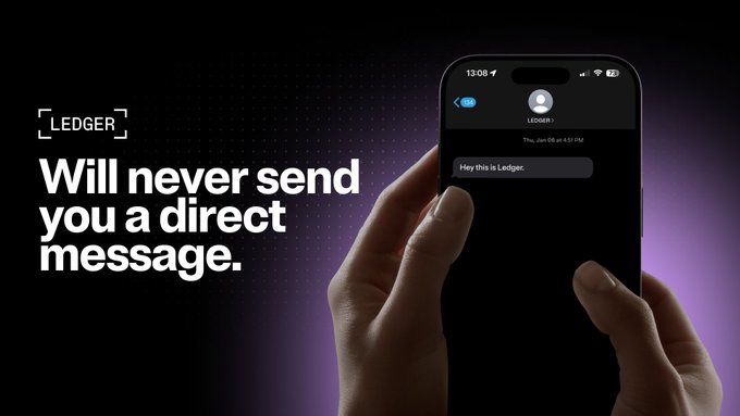 A Ledger advertisement with text reading 'LEDGER Will never send you a direct message' alongside a smartphone showing a text message from Ledger saying 'Hey this is Ledger.'