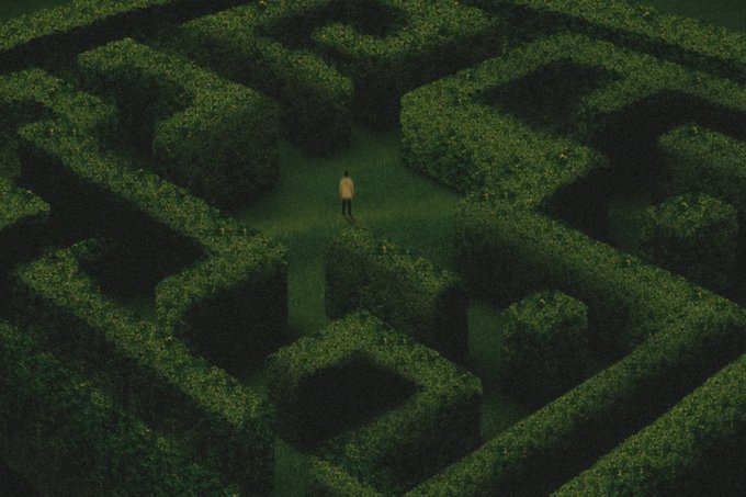 A dark, atmospheric overhead view of a solitary figure standing in a vast, intricate green hedge maze.