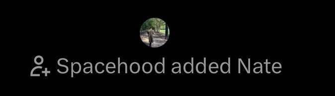 A dark notification screen displaying a profile picture of a person in a park with the text '+ Spacehood added Nate'.