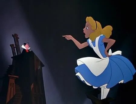 An animated scene featuring Alice from Disney's Alice in Wonderland pointing accusingly at the Doormouse in a judge's chair, depicted in a courtroom setting.