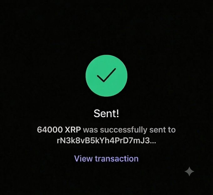 The image shows a screen displaying a green checkmark with an exclamation point inside of a circular shape that reads "SENT!" The background is black, and there are two white stars located near the bottom edge of the picture. The image also includes text which says "I wanna send $64,000 to another follower who has never won Just say '$XRP'". This message seems related to a video game or some online interaction where someone is congratulating their friend on winning XRP currency.