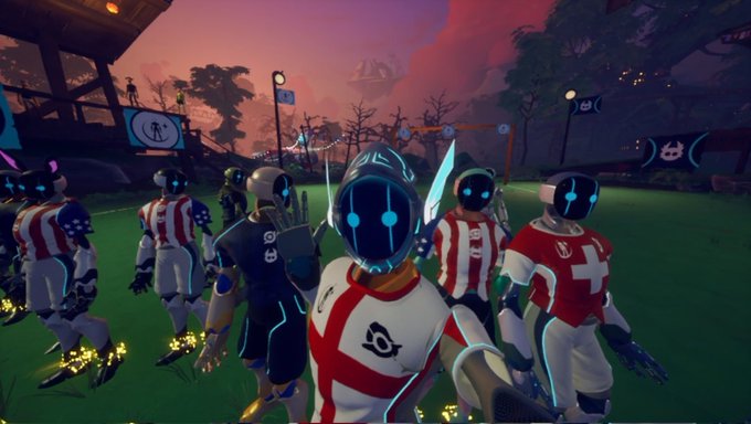 The image features a group of people dressed as football players, standing together with their helmets on. They are positioned in front of a field that has a sunset backdrop, creating an atmosphere reminiscent of a football game at dusk. The text "Football's coming home! @OthersideMeta" is also present in the image, which suggests that this scene might be related to a post about the football team or their upcoming match.