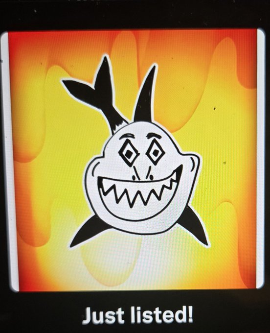 A cartoon shark character on a fiery orange background with the caption 'Just listed!'.
